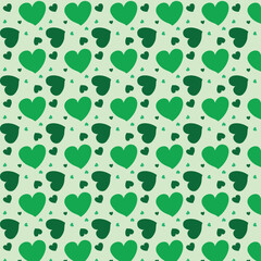 Valentine's Day seamless pattern. Love hearts icons background. Abstract repeated texture. Green hearts symbols on a pink background. Suitable for clothes prints, greeting cards, holidays design