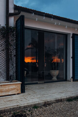 Golden Sunset Reflected in Glass Entrance