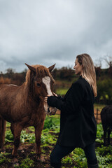 Young Woman with Horse in Autumn Nature