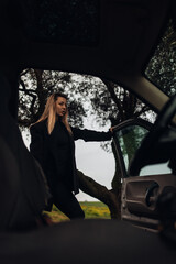 Young Woman in Old SUV car on a Farm