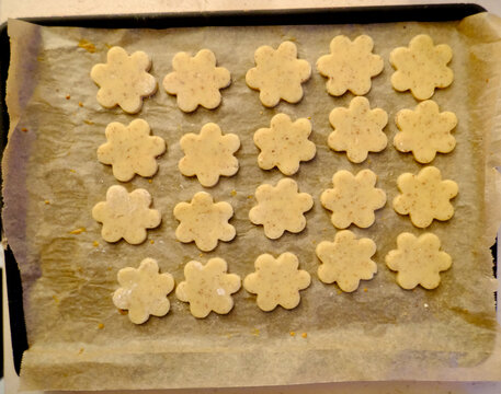 Unbaked Flower-Shaped Alsatian bredele bredala Cookies on Baking Tray