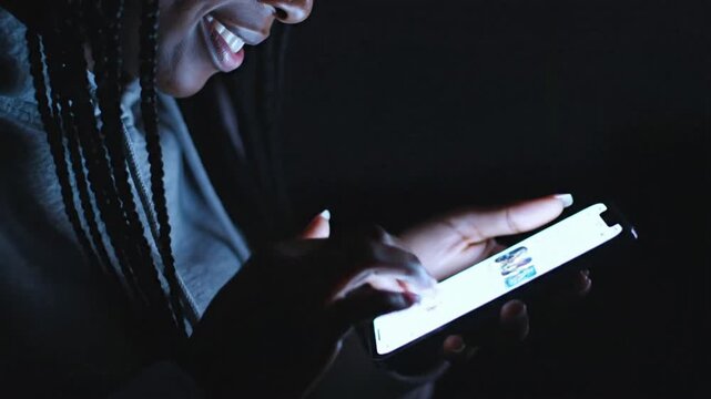 Person using smartphone in the dark