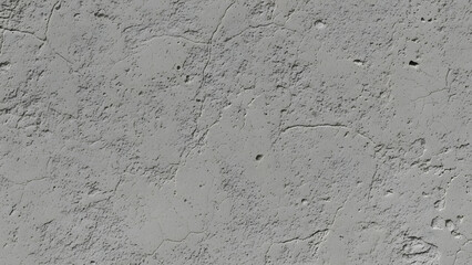 A close-up view of a gray concrete surface with visible texture and imperfections