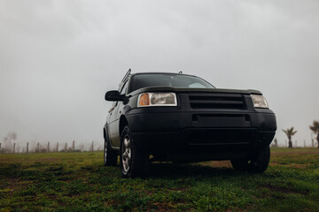 Vintage Off-Road Vehicle in Morning Fog