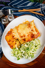 Stuffed pancake baked with cheese.