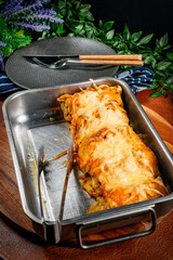 Stuffed pancake baked with cheese.