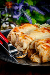 Stuffed pancake baked with cheese.