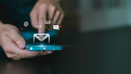 digital notifications, tax, mobile communication, fintech alerts, and secure business messaging technology. A hand interacting with a smartphone with email icon with tax and analytics symbols.