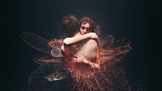 Futuristic 3d scan of a romantic couple embracing passionately. Their bodies are dissolving into a beautiful cloud of glowing particles