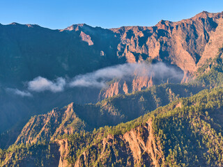 Aerial view of steep volcanic ridges and forested slopes inside Parque Nacional de la Caldera de Taburiente on La Palma, ideal for: nature editorials, adventure travel campaigns and premium wall art.
