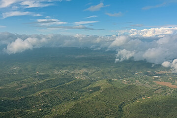 Obraz premium Aerial view from Sant Jeroni mountain, above the clouds on the surrounding landscape. Catalonia, Spain 