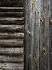 Old wooden log wall and door. Unusual travel textures concept. Handmade smartphone photo, selective focus, non AI