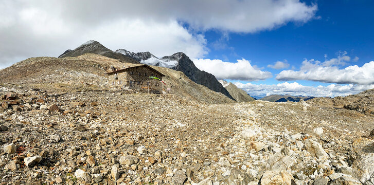Hiking through the magnificent high mountain landscape with peaks and glaciers of the South Tyrolean Alps in the Antholz Valley near Bruneck, Rieserferner area of ​​the Dolomites, South Tyrol, Italy
