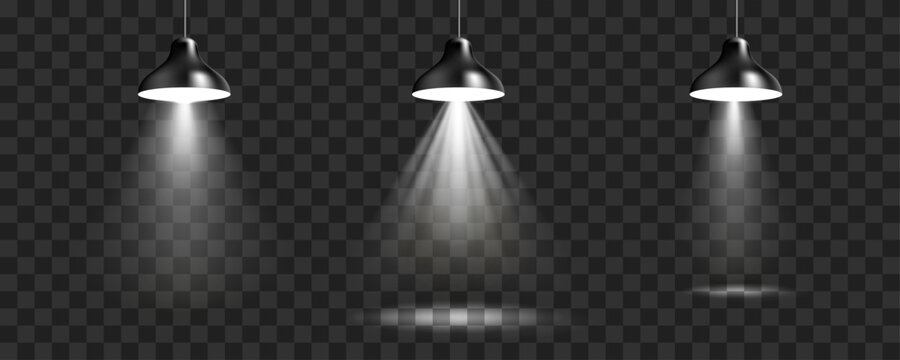 Three modern black pendant lamps illuminate dark background with spotlights effect creating dramatic atmosphere