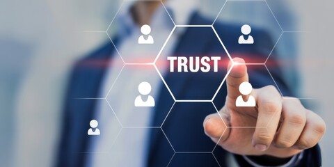 Digital Trust: A person's finger hovers over the word TRUST on a virtual interface, surrounded by connected figures, symbolizing faith in the online sphere and the value of connections.