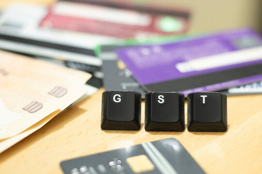 GST India Goods and Service tax implementation with keyboard alphabet key GST return file business tax service tax india concept illustration of business tax