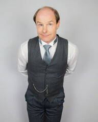 Butler With Hands Behind Back Eager to Be of Service. At Your Service.