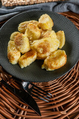 Homemade lazy noodles with cheese, crumbs and melted butter.