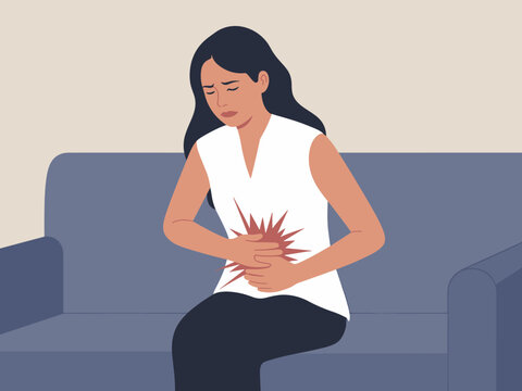 Stressed young woman suffering from stomach ache abdominal pain sitting on sofa at home upset girl having menstrual period cramps indigestion or food poisoning health problem healthcare and medical il