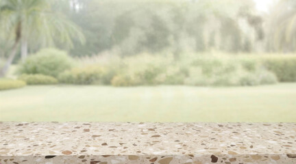 Terrazzo table top on blurred or defocused green tropical garden background product display mockup