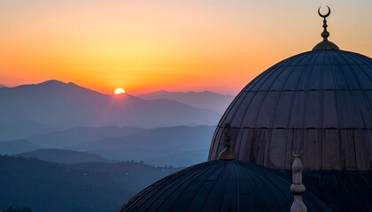 Mosque dome at sunset with mountains in the background.