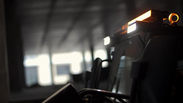 Construction loader with flashing warning lights on site