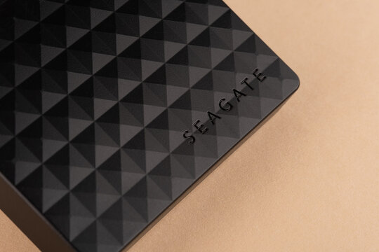 Omsk, Russian Federation - January 09, 2026: Seagate external hard drive on a smooth surface, showcasing its sleek design and textured pattern, ideal for data storage solutions 