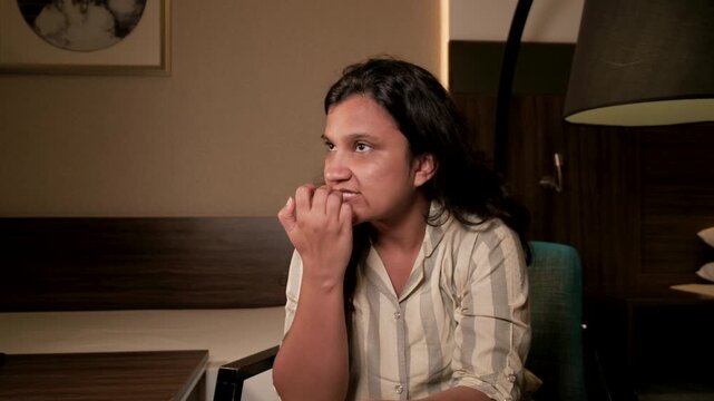 Anxious woman biting nails struggling with low self confidence