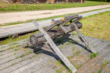 Wooden Sawhorses Near Traditional Village House