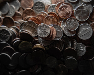 Pile of Assorted American Coins with dramatic light