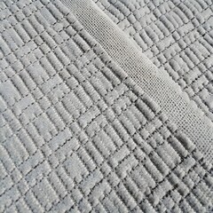 Fototapeta premium Seamless Light Grey Quilted Cotton Fabric with Diamond Grid Pattern and Textured Border Stripe Background