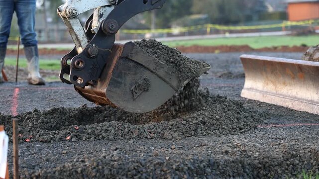 Earthmover digging and dumping