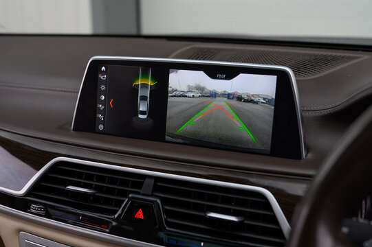 Car reverse camera screen showing parking guidance lines