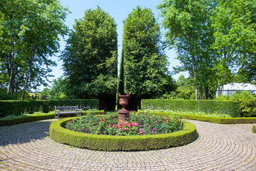 A 19th-century cast-iron vase with a linden alley. Orekhovno Estate. Orekhovno village, Pustoshkinsky District, Pskov Oblast, Russia.