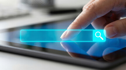 Hand touching a futuristic glowing blue search bar on a digital tablet screen, illustrating quick information access and global connectivity.