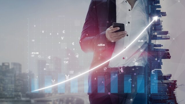 A business professional stands in an urban environment, using a smartphone while surrounded by digital financial data visualizations and a rising growth trend. Copula - Powered by Adobe