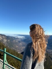 girl on the top of the mountain