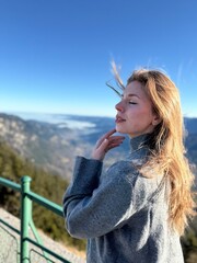 girl on the top of the mountain