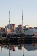 Tower cranes high in sky at construction site © Richard Johnson