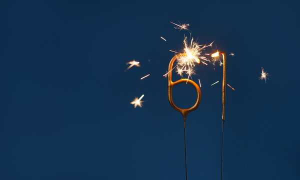 61 years celebration festive background with copy space made with Bengal fires in the form of number Sixty one.