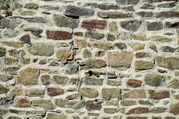 Brick wall texture with uniform rectangular bricks and visible mortar lines in a flat surface. Architectural background showing construction material, building facade, structural detail, pattern