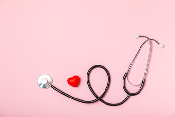 Cardiology. Stethoscope heart. Red heart with doctor's stethoscope on background, hospital life insurance concept, World Heart Health Day. Doctor Day. Medical assistance. Heart disease. Heart attack. 