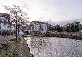 View down the River Wensum towards the Novi Sad Friendship bridge in the city of Norwich