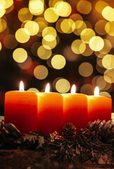 Four candles with christmas decoration