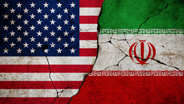 USA and Iran Geopolitical Tension. flags of United States and Iran painted on cracked wall. Represents economic sanctions, nuclear deal conflicts, fragile Middle Eastern diplomacy