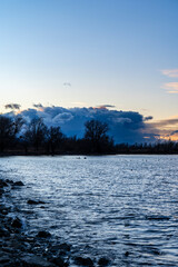 blue hour over Lake Constance Bodensee seen from the border of Bregenz, Vorarlberg, Austria in winter