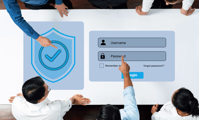 A diverse group of business professionals is actively discussing online security practices while interacting with a login screen and password protection concept at a modern workspace. Gantry