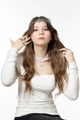 Portrait of a beautiful young girl with jewelry
