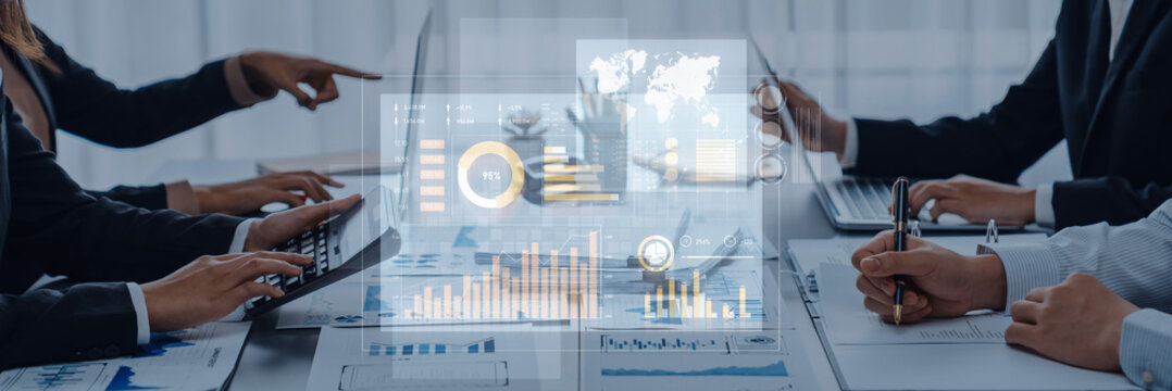 Business professionals engage in a collaborative meeting, analyzing data trends through a digital interface in a modern office, highlighting teamwork and technology integration. Scalp - Powered by Adobe