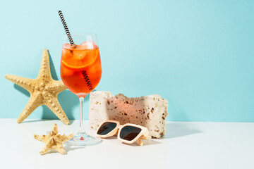 Fototapeta premium Aperol Spritz, Summer alcohol cocktail drink at blue background.